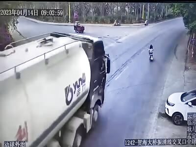 Poor Chinese girl on scooter crashed under fuel truck 