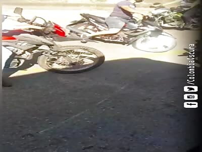 Motorcyclist laying dead in middle of the street after accident 