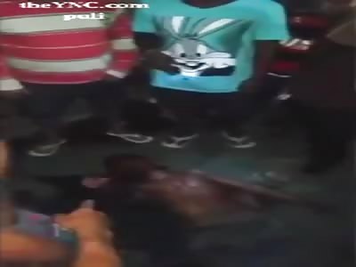 Bloodied Brazilian thief puts on the ground after winning