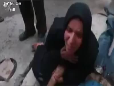 Syria|n woman mourns the death of her husband, 