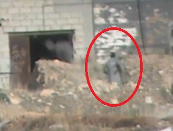 Syrian army sniper soldier in the neighborhood standing south of Damascus
