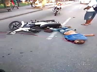 MOTORCYCLIST. HIT BY A CAR