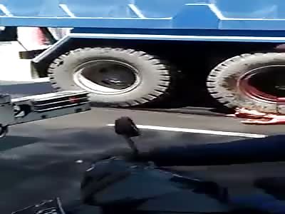 MOTORCYCLE, IT'S CRUSHED BY THE TRUCK WHEEL