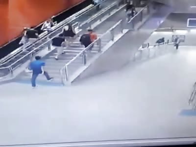 Moron Falls to His death from Escalator 