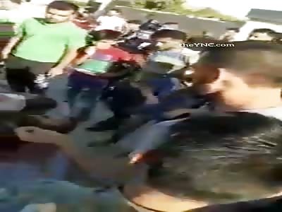 ISIS, Turkish factions execute civilians in a public square under the 