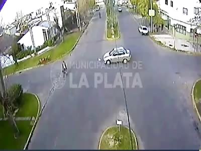 CCTV. Argentina. Motorcyclist crashed into a car. 
