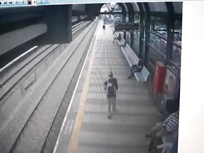 Train Suicide (Also, Shows Dude Cut in Half after Hit)