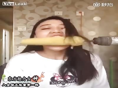 Woman gets hair pulled off when challenging rotating corn