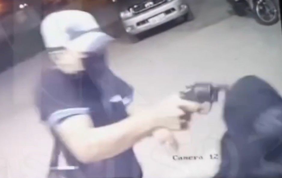 SECURITY GUARD BEING RIDDLED WITH BULLETS