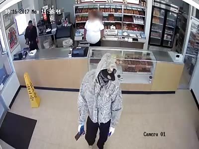 ARMED ROBBERS HAND OUT DONUTS WHILE ROBBING DONUT SHOP