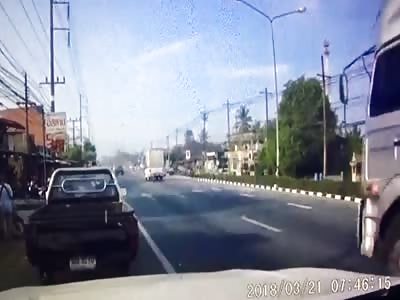 Guy on a scooter gets killed by transport truck