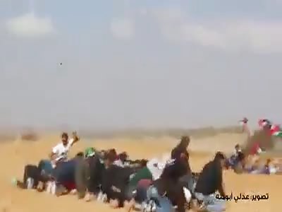 SNIPER SHOOTING UNARMED PALESTINE PROTESTER DURING PRAYERS!!