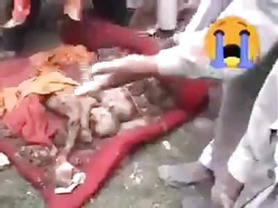 Dead Babies Piled On Top Of Each Other As A Result Of Pakistan Army 