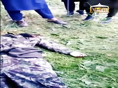 Taliban Show Off Dead Islamic State Fighter