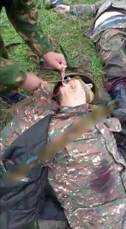 Azerbaijani Soldiers Cuts The Ear Off Of A Corpse