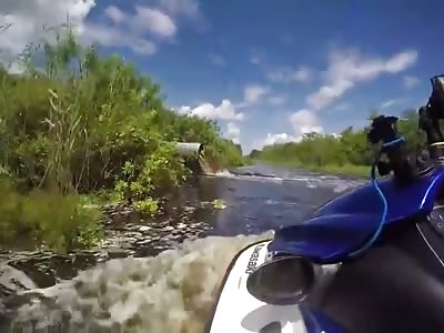 Redneck idiot falls to pollute water from jetski