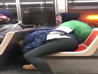 Couple caught in advanced foreplay in subway.