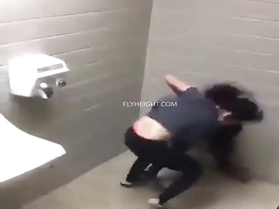 Young girls throw hands in bathroom