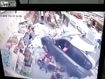 Female driver slams into grocery store