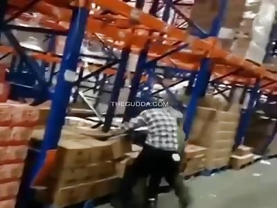 Two coworkers fed up with one another throw down inside the warehouse!