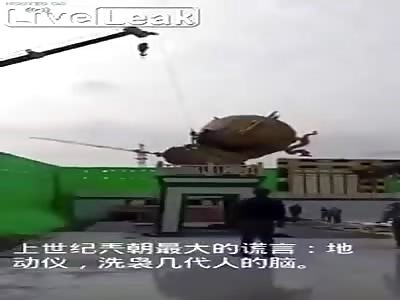 Crane drops chinese monument