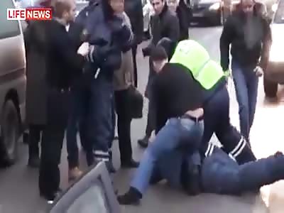Man causes traffic crash and beaten by drivers and police