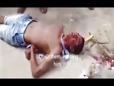 Thief beaten by locals and tied up