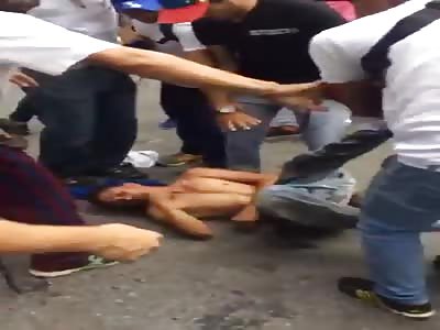 thief brutaly beating in venezuela 