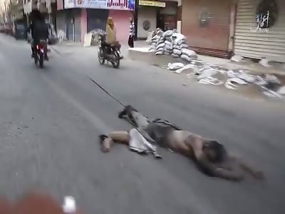 PKK member being dragged down the streets by daesh