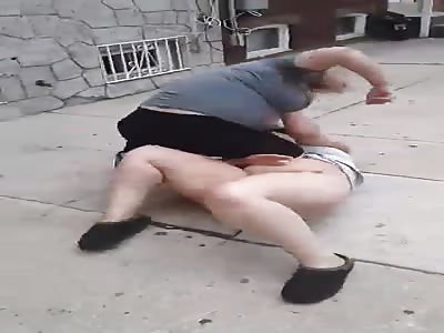 Women fighting and one gets naked
