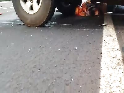 Accident  with bike    Woman has her head crushed by a pickup truck.