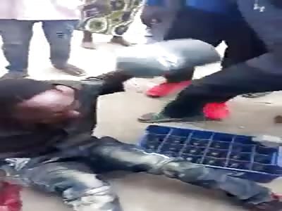 thief beaten by people