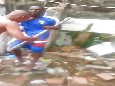 thief brutally beaten with sticks in favela 