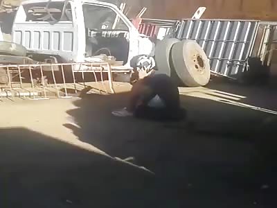 Tire explodes man goes flying.