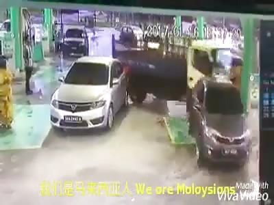 truck drives into petrol station