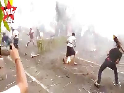 youths throw fire at each other 