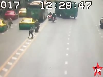 Biker falls over then a truck runs over his head