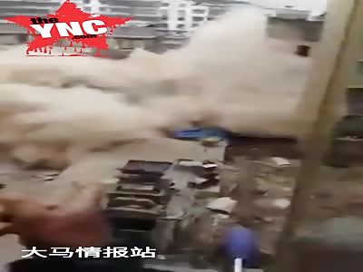 an apartment block falls on to workers 