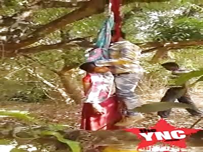 Short Video:  Love couple hang them self on a tree