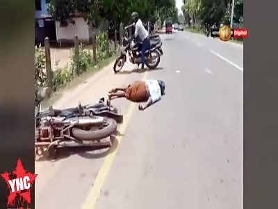 2 bikes collide with each other sending them flying in the air