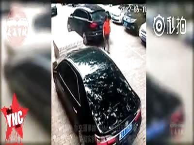 A woman is killed by a reversing car