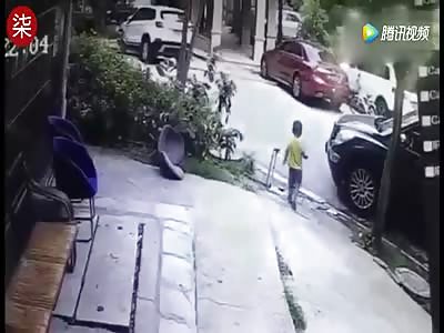 boy gets crushed by a car