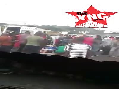 onlookers drive past a deadly accident in  CÃ´te d'Ivoir