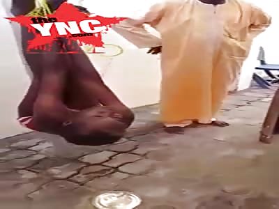 in Nigeria  Woman Tied Upside Down Brutally Beaten After Confessing To Be A Witch
