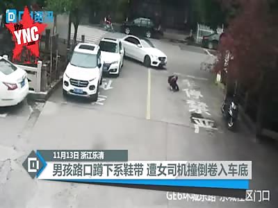 boy gets crushed by a car in in Yueqing City