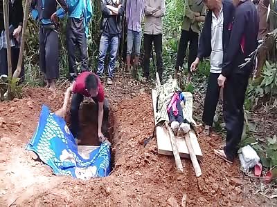 a burial of a boy killed in Laos 