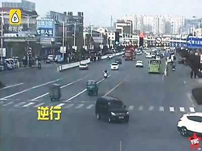 in Shandong a grandfather rides his tricycle with his cover down while on a busy road he was nearly crushed