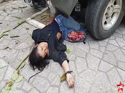 a woman's legs are crushed under a lexus lx450 in Cambodia (Still Alive)