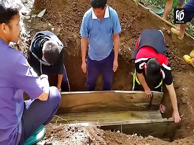 a  peasant burial of a man that Hanged Himself in Laos 