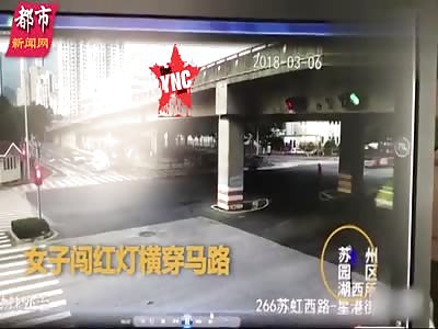 woman crossing the road gets crushed in  Suzhou